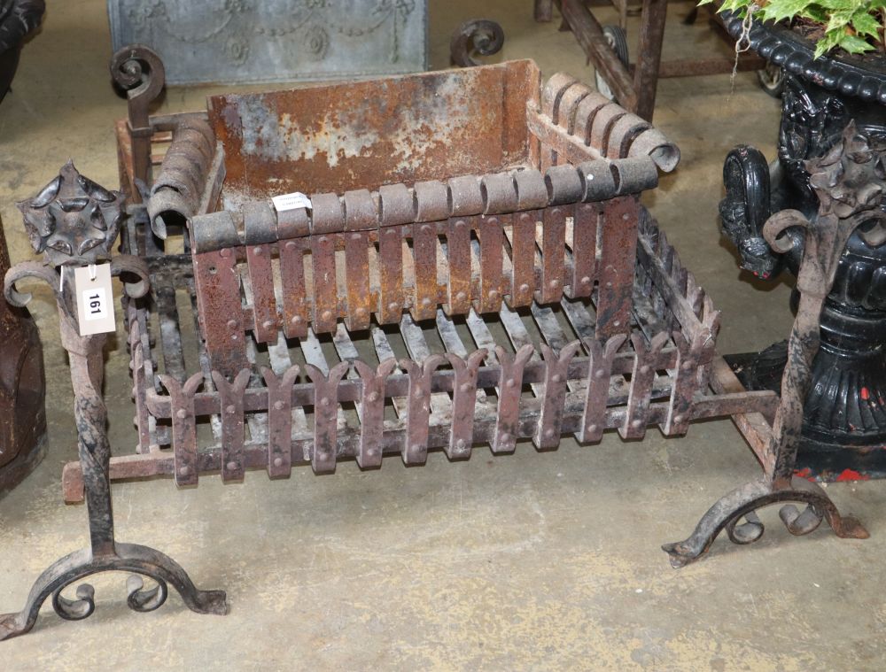 Three wrought iron fire baskets and a pair of dogs, largest basket W.70cm